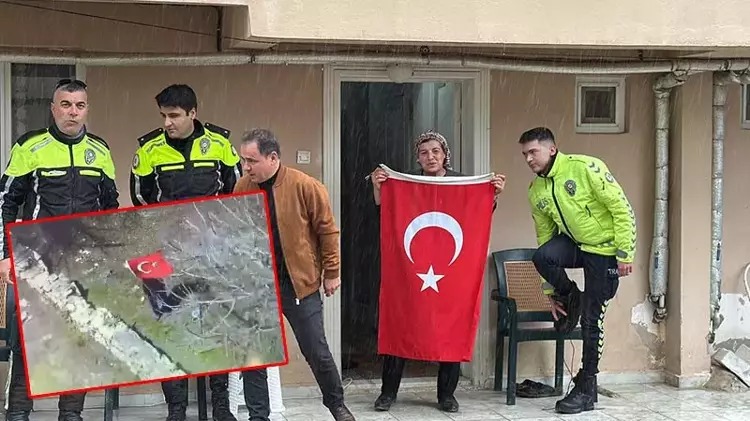 Elinde Türk bayrağı ile polis helikopterini selamlayan kadına plaket;
